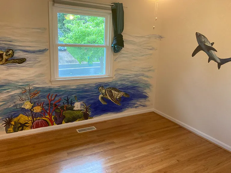 Upstairs bedroom with custom painted ocean scene. To be enjoyed and not painted over.