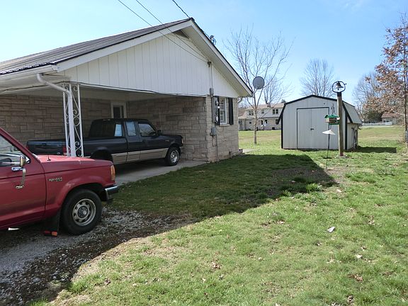 side view of car port and st