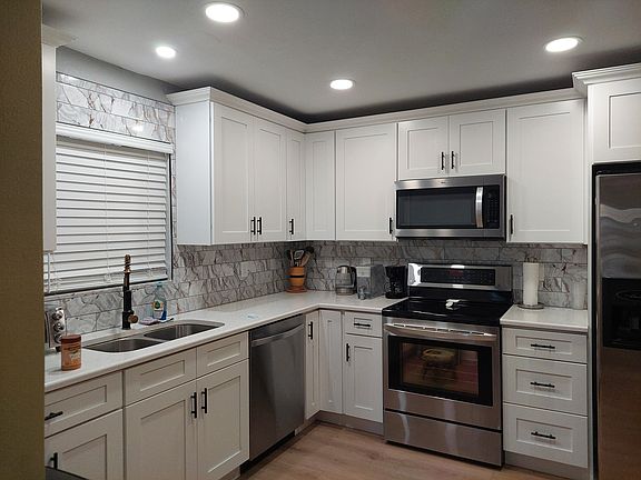 The kitchen completely open to living room and dining room.