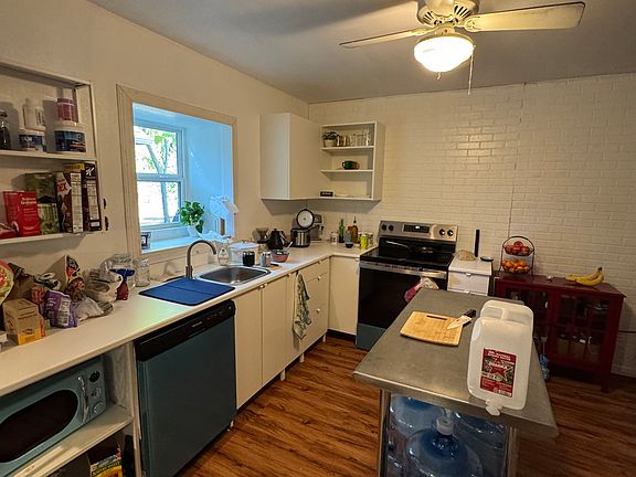 Kitchen area with dishwasher and stove/oven.