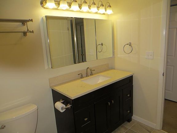 Bathroom with new 4' vanity & storage mirror