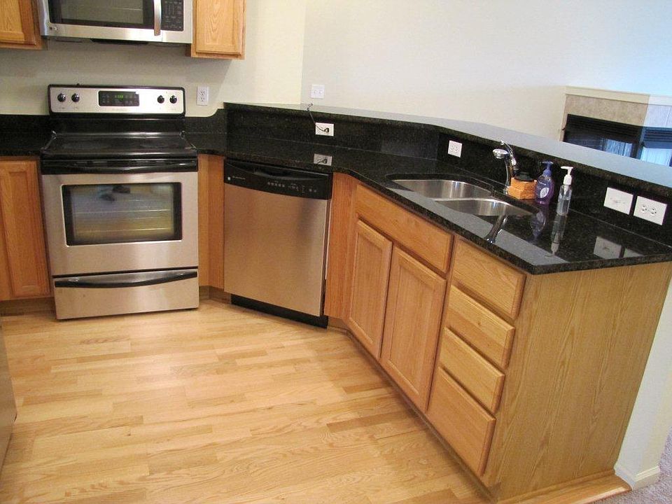 Kitchen with oak cabinets, granite counters and stainless ap