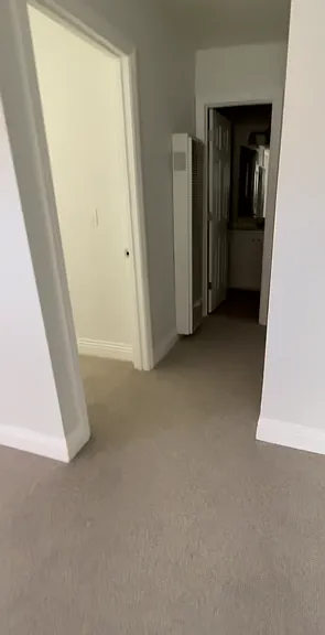 Hallway to bedroom, bathroom, and laundry room
