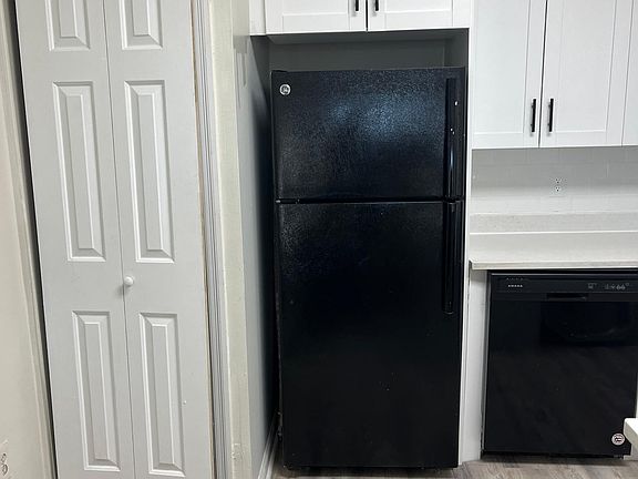 behind the door is laundry/dryer set.