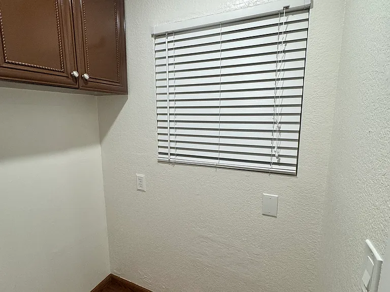 Walk in pantry/bonus room located in kitchen. Shelving will be hung prior to move in time.