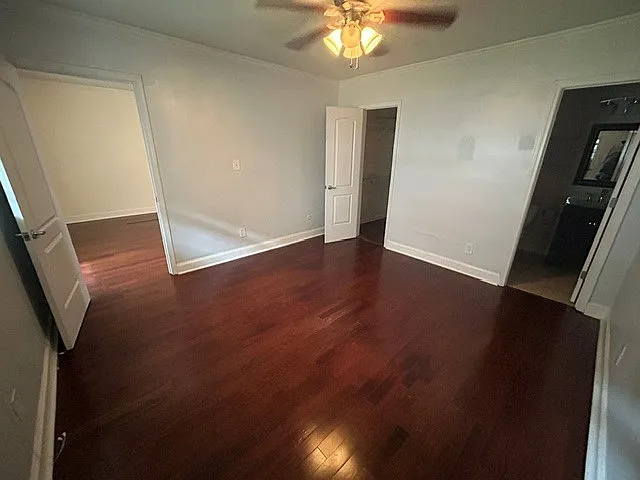 Bedroom. Bathroom to right, closet in center, living room to the left.