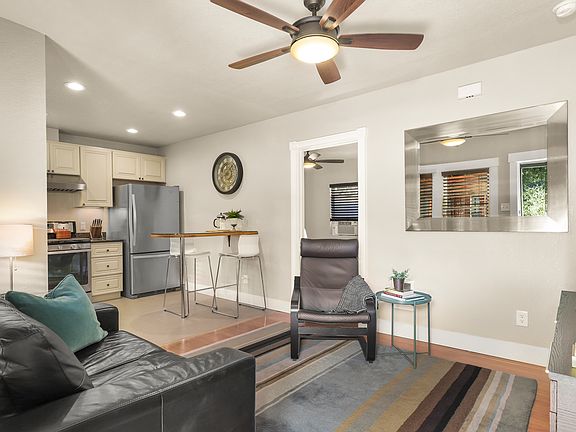 Living room and kitchen looking into bedroom