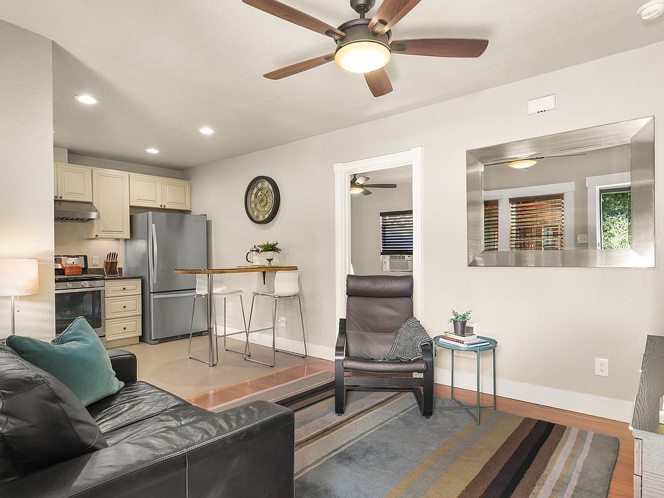Living room and kitchen looking into bedroom