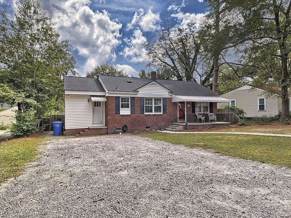 Front of house - now has paved concrete driveway!