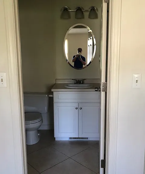 Primary bathroom featuring tile flooring and a stand up shower which is clean, functional, and well maintained.