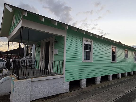 Side of house and private driveway for off-street parking.