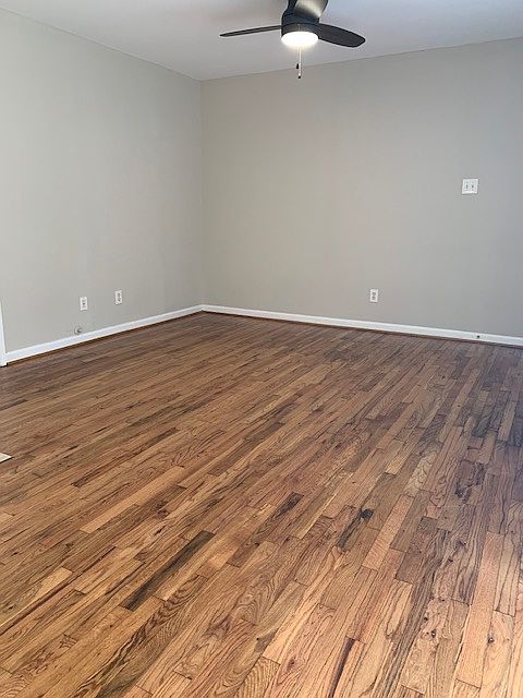 Large living room features real hardwood floors, recently refinished.