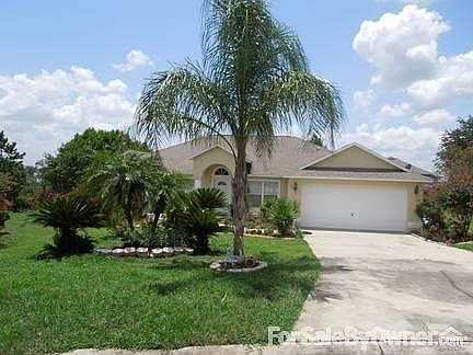 FRONT DRIVEWAY FULLY LANDSCAPED