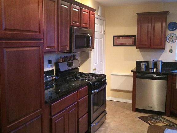 Remodeled Kitchen - all stainless steel and tile. Huge Pantry Cabinet.