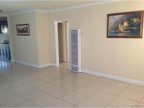 LIVING ROOM WITH ELEGANT PORCELAIN FLOORS, CROWN MOLDING