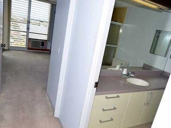 hallway to bedroom and bathroom