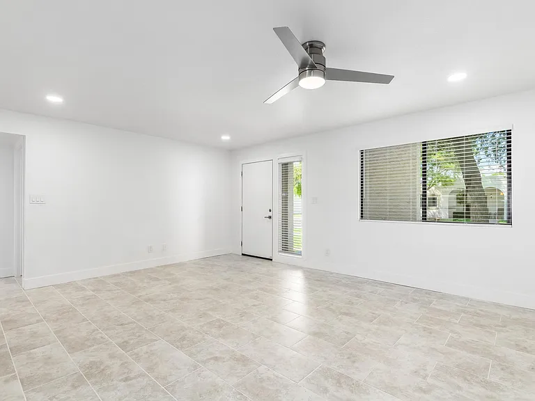 Front door with bright window viewing to beautiful green grass walkway