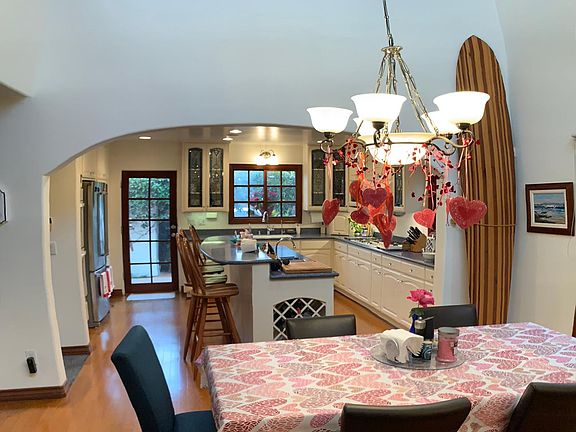 Dining room enters into kitchen. Workout room/office above.