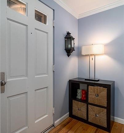 Spacious entryway with hardwood flooring.