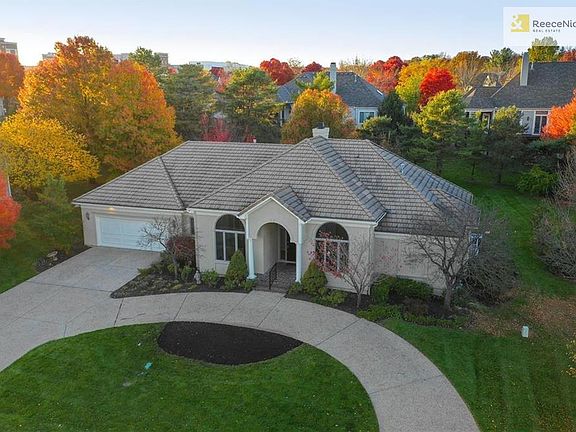 Big lot with lots of trees and circle driveway
