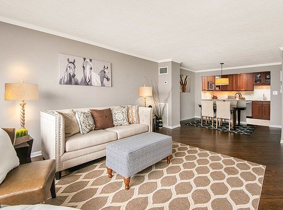 Open concept floor plan is perfect for entertaining with a large living room and dark hardwood floor