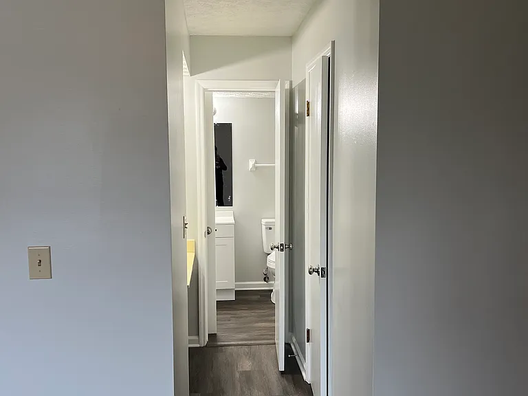 Corridor from Owner's Suite to Bathroom. Walking Closet in between.