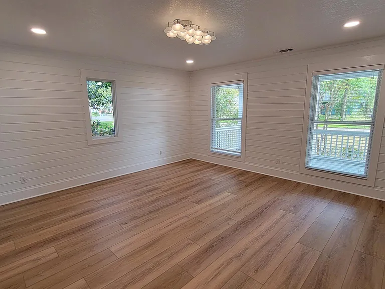 Primary Suite 15 x 14, Luxury Vinyl Wide Plank Floors, Ship Lap Walls