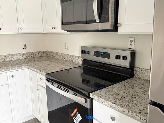Kitchen with all new appliances and cabinets