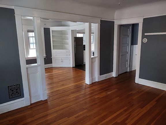 Standing in the living room, looking into the dining room