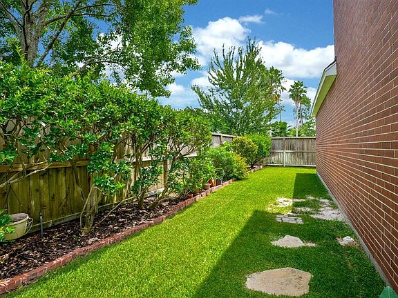 This side yard would be perfect for your organic garden!