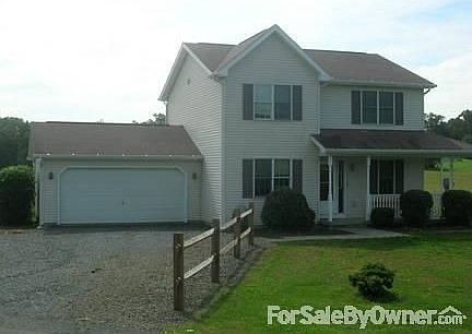 Front View
						:
						2 Car Garage, porch, and spacious driveway with turnaround.