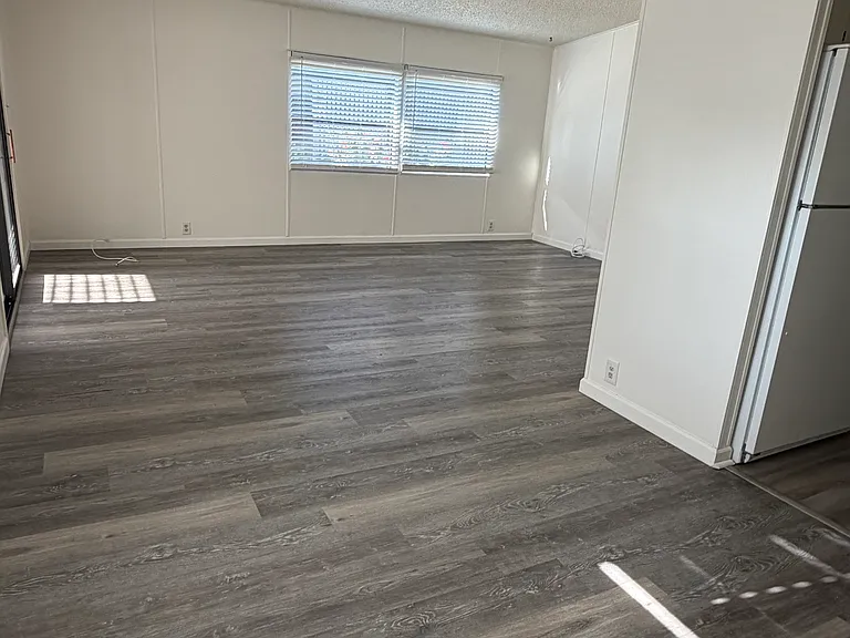 open view from dining room to living room