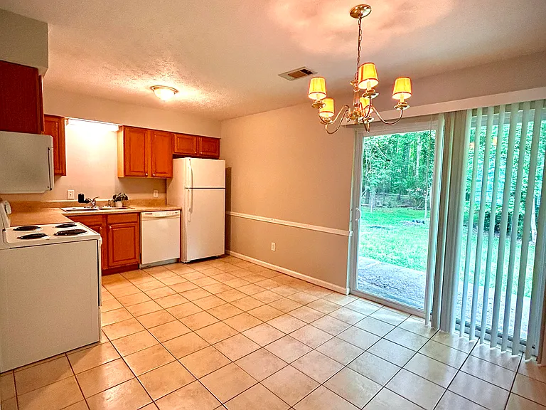 Kitchen and dining room with tile flooring