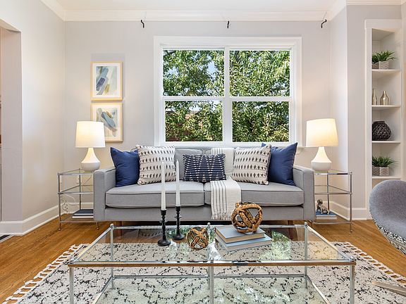 Open, airy feel with abundant windows and abundant light! Court view with lovely tree, oak hardwoods, French doors, period millwork, stylish and soothing colors, open floor plan.