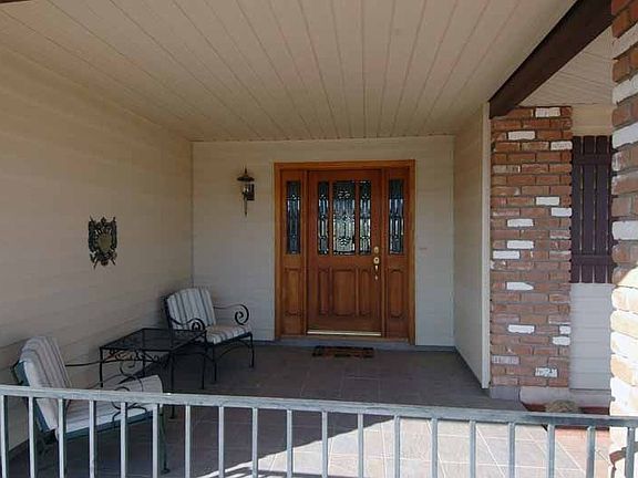 Covered and tiled front entry patio