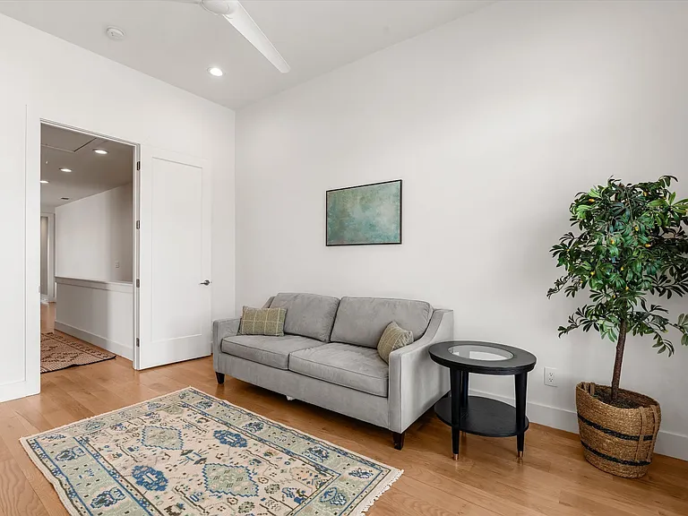 Third bedroom currently styled as a playroom but functions as a full bedroom with closet.