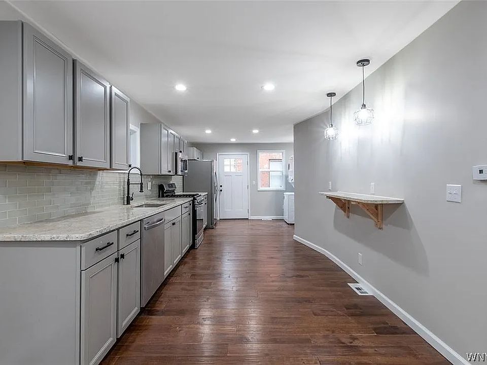 Kitchen area look toward back door.