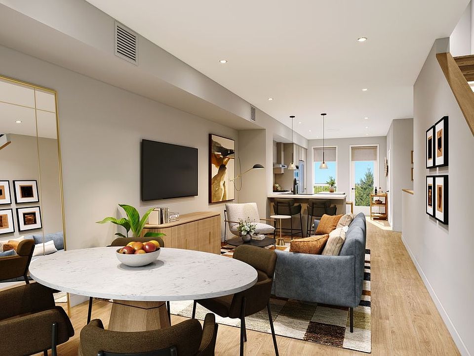 Signature Collection I 3-Bedroom Townhome living area with hard-surface vinyl plank flooring throughout (Rendering)