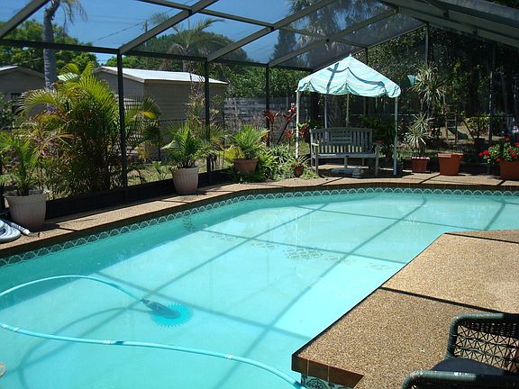 caged pool,deck, lanai