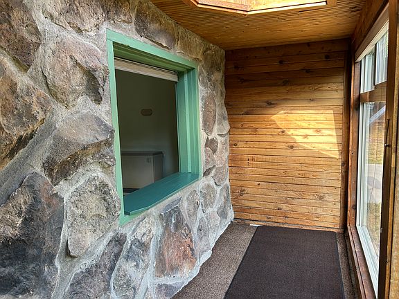 The South facing sunroom at front of house is wonderful for passive solar heat and plant lovers. Cellular blinds keep the heat in at night.