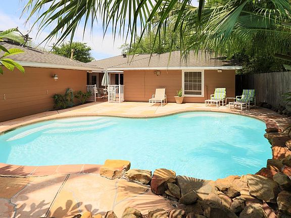 Another gorgeous view of the pool area. The spacious 2 car, detached garage, is situated to the left