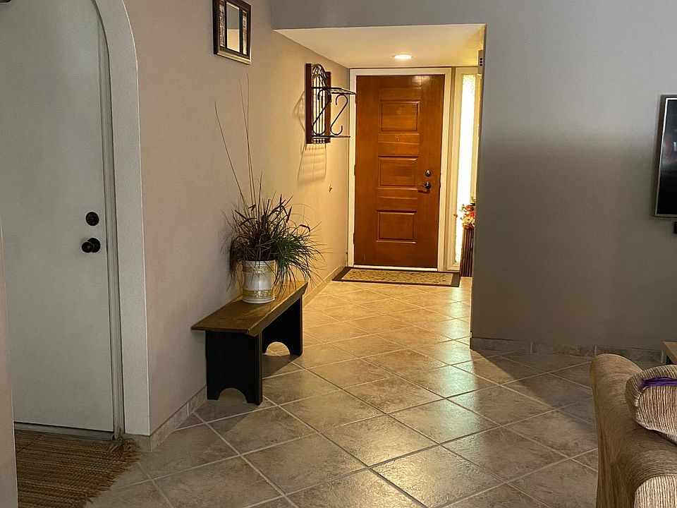 This Property is a unique rental for THREE to FOUR month at most. Front entrance of the home. Entrance door to the garage.