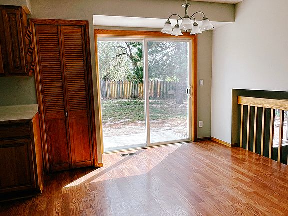 Easy care Luxury Vinyl Plank flooring in dining area. Looking from living room to backyard.