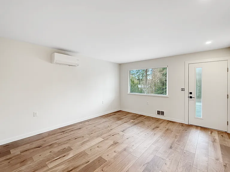 Living room is open to the front of the home! Brand new Luxury Vinyl Plank flooring!