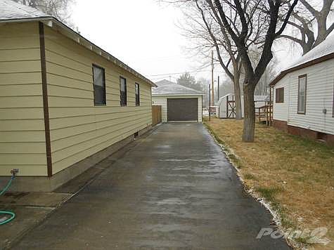 Long, concrete driveway.