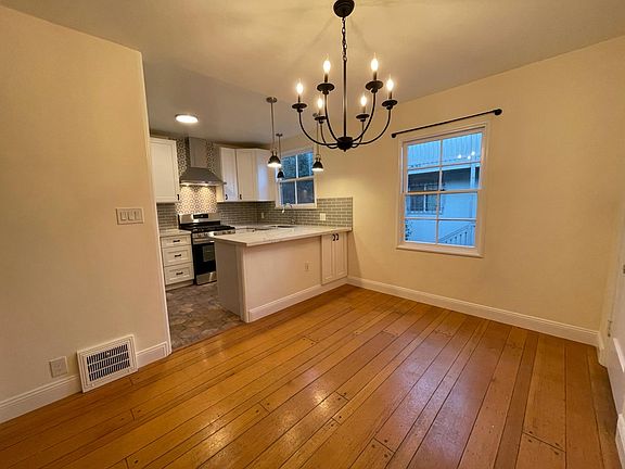 Charm with and open kitchen.