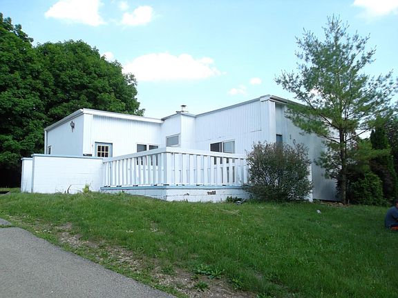 House has recently been updated with attractive tan siding. On corner lot with balcony and courtyard.