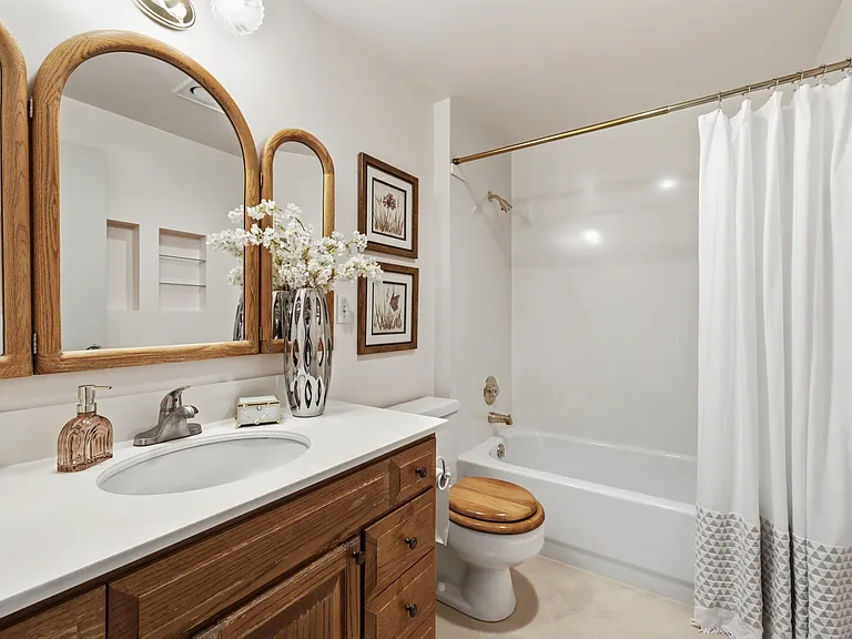 Full bathroom with quartz-look vanity and tub/shower