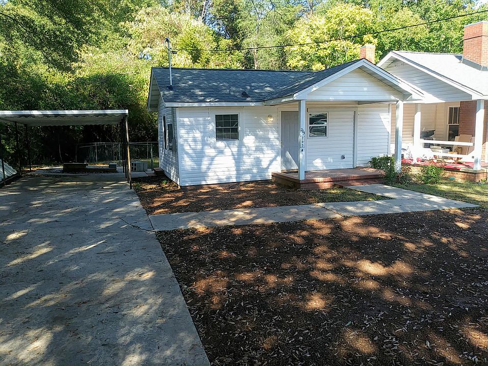 Front of House with Carport.