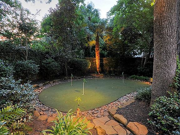 JUST A FEW DOORS FROM FAMED DEERWOOD CC, THIS HOME HAS IT'S OWN PUTTING GREEN SO YOU CAN SHARPEN YOUR SHORT GAME ON YOUR OWN TIME. NOT A GOLFER? EASILY CONVERT THIS AREA TO GREEN SPACE OR PLAY AREA.